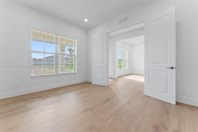 spare room with light wood-type flooring