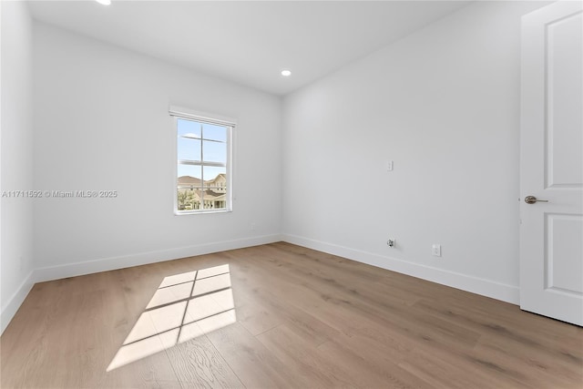 unfurnished room featuring light hardwood / wood-style flooring