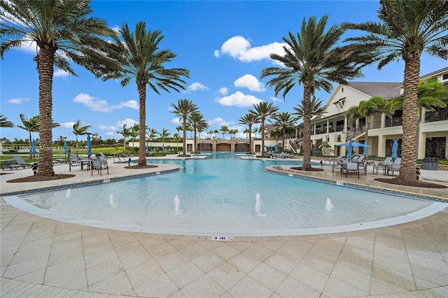 view of swimming pool with a patio area and pool water feature