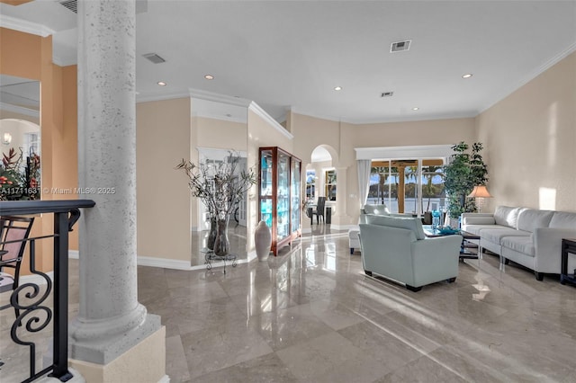 living room featuring crown molding and decorative columns