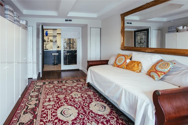 bedroom featuring a closet and dark wood-type flooring