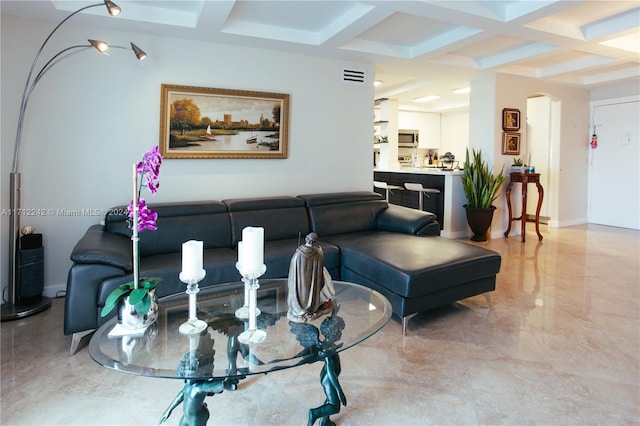 living room featuring beamed ceiling and coffered ceiling