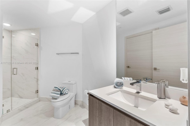 bathroom featuring vanity, toilet, and a shower with shower door