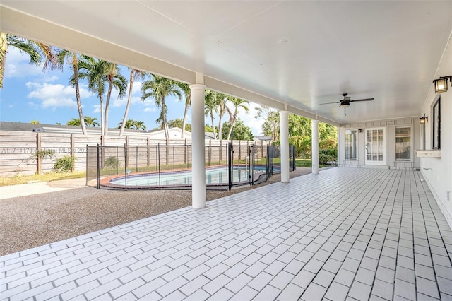 exterior space with ceiling fan and a patio