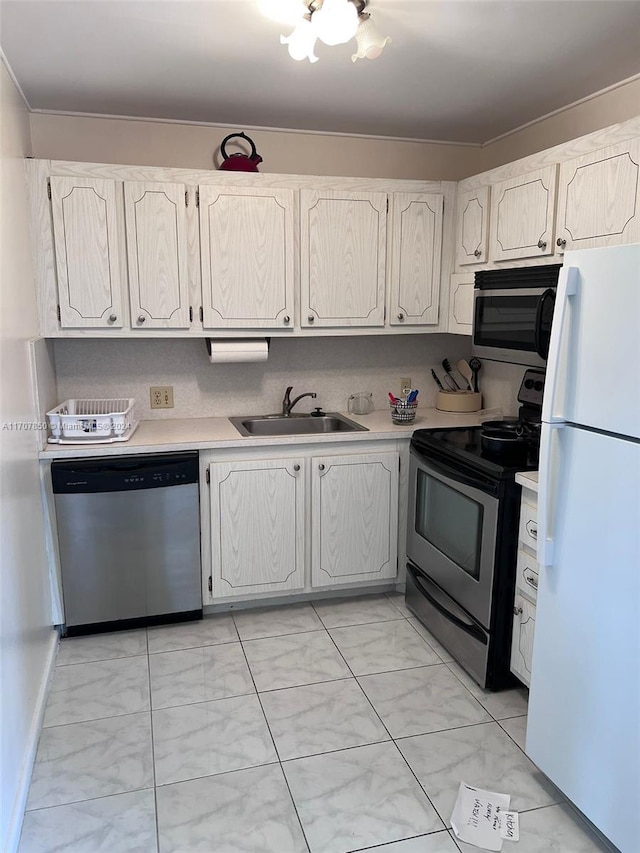 kitchen featuring sink, white cabinets, and stainless steel appliances