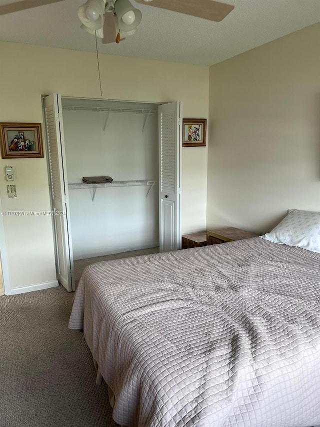 bedroom with ceiling fan, a closet, and carpet floors