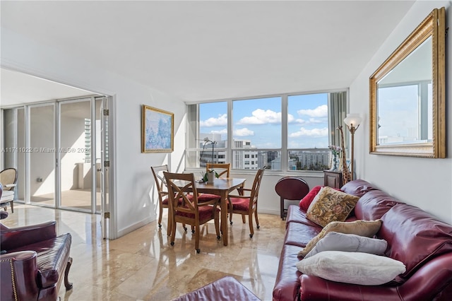 interior space with floor to ceiling windows and a healthy amount of sunlight