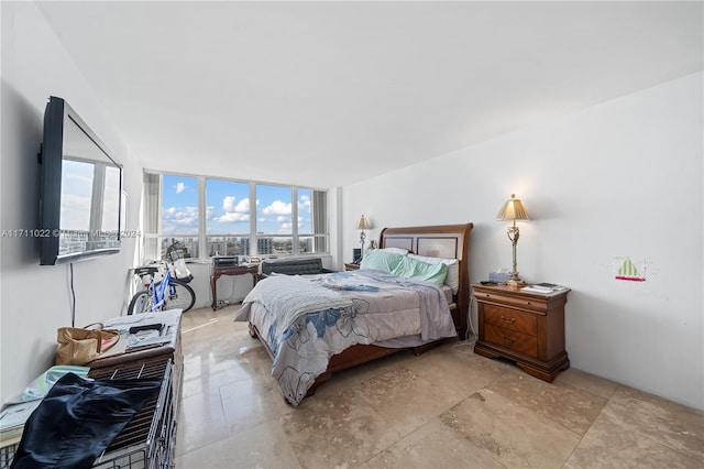 bedroom featuring a wall of windows