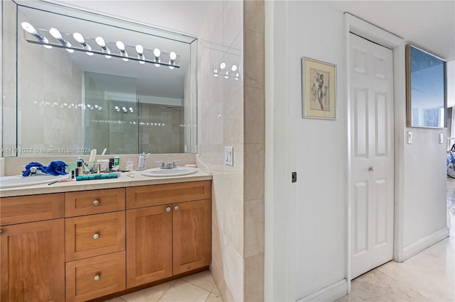 bathroom featuring vanity, tile patterned floors, and walk in shower