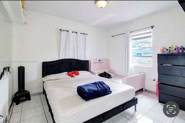 bedroom with light tile patterned flooring