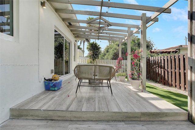 wooden terrace with a pergola