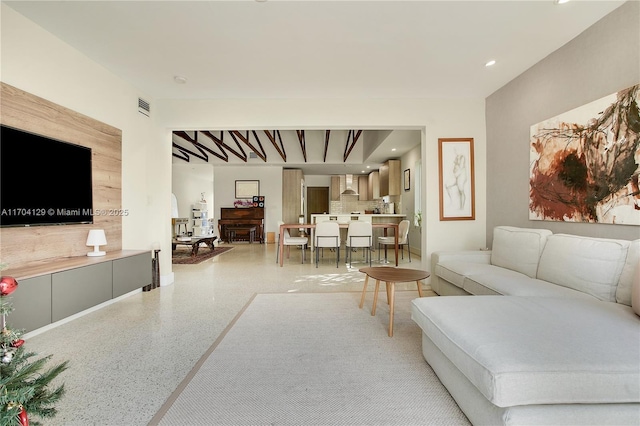 9008 Dickens Ave, Surfside, FL 33154 - living room with speckle patterned floor and recessed lighting