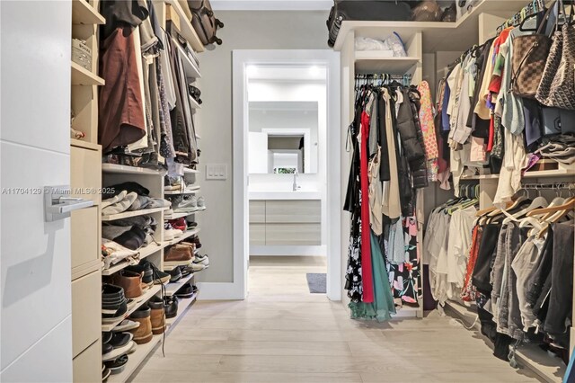 9008 Dickens Ave, Surfside, FL 33154 - spacious closet featuring wood finished floors