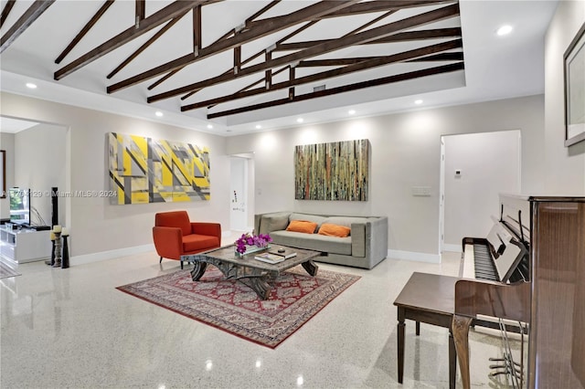 living room with vaulted ceiling with beams