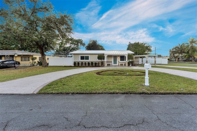 ranch-style home with a front yard