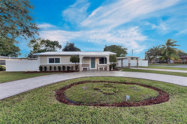 view of front of house featuring a garage and a front yard