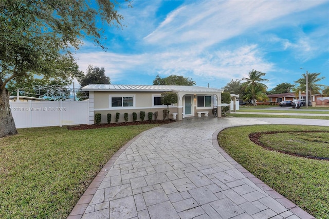 ranch-style home with a front yard