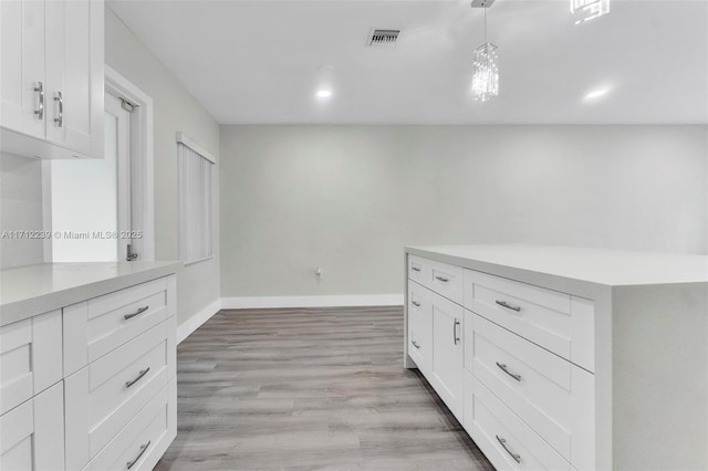 walk in closet featuring light wood-type flooring