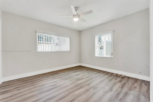 unfurnished room with ceiling fan and light wood-type flooring