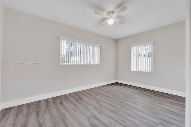 empty room featuring ceiling fan and light wood-type flooring