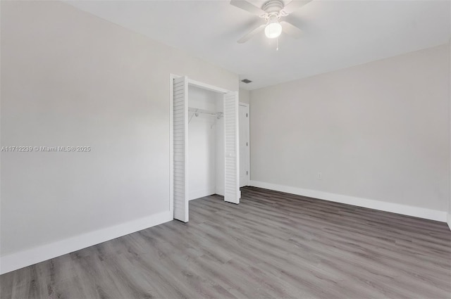 unfurnished bedroom featuring a closet, ceiling fan, and light hardwood / wood-style floors