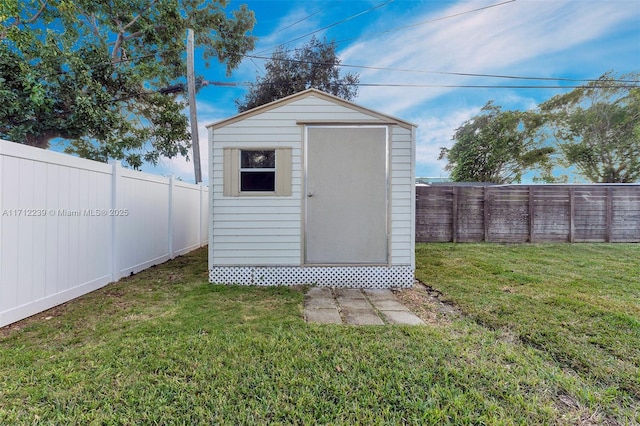 view of outdoor structure with a lawn