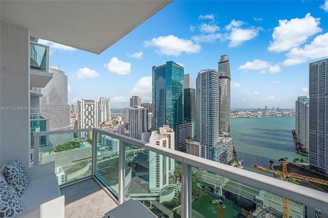 balcony featuring a water view