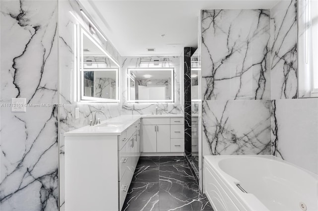 bathroom with vanity and a tub