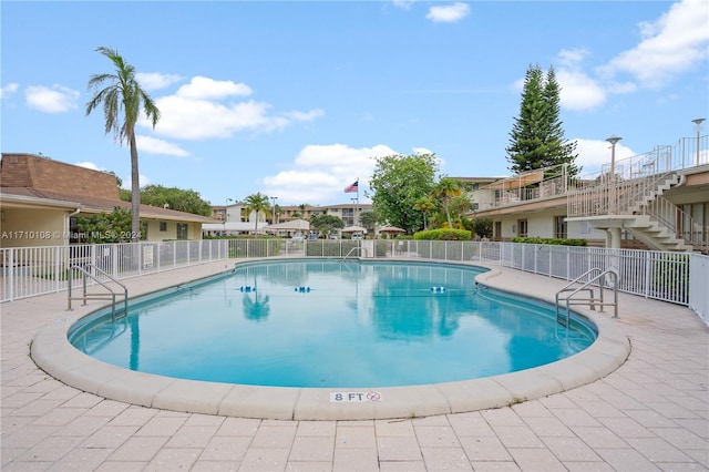 view of pool featuring a patio