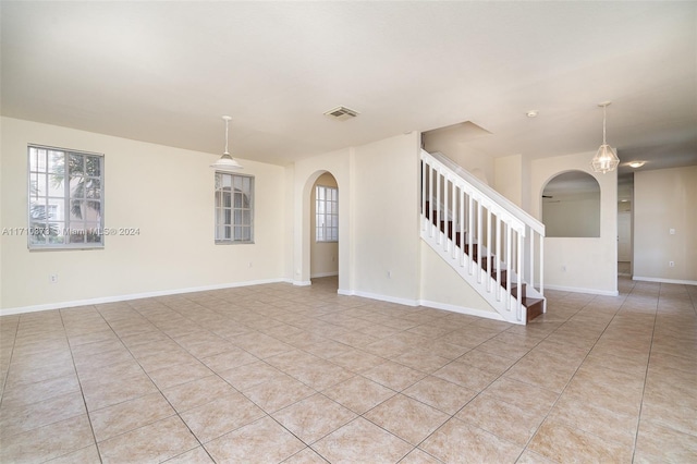 empty room with light tile patterned flooring