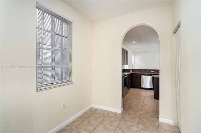 hallway with light tile patterned flooring