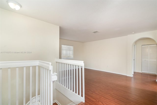 hall featuring dark wood-type flooring