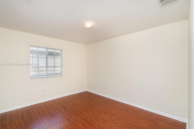 empty room featuring hardwood / wood-style floors