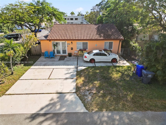 2716 Polk St, Hollywood, FL 33020 - view of front of property featuring a tile roof and stucco siding