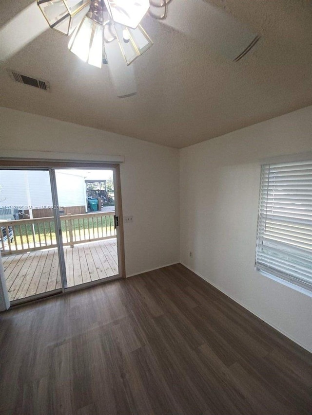 empty room featuring dark wood-type flooring