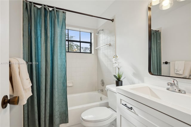 full bathroom featuring vanity, shower / tub combo, and toilet