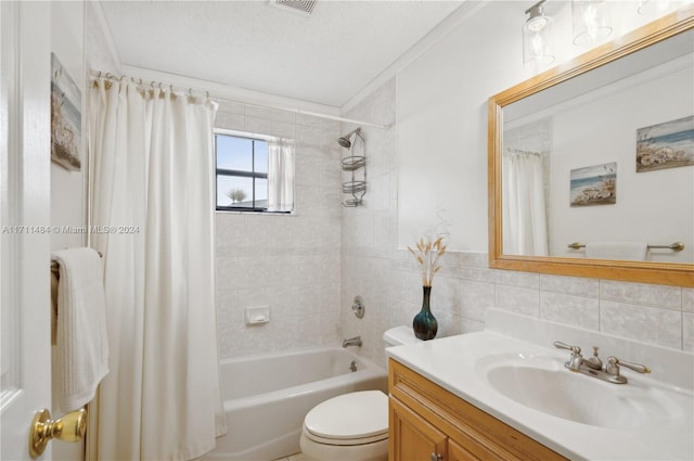 full bathroom featuring a textured ceiling, vanity, shower / bath combo with shower curtain, tile walls, and toilet