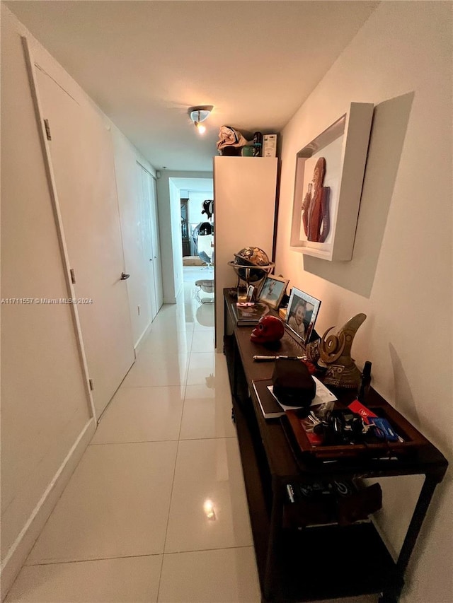 corridor featuring light tile patterned floors