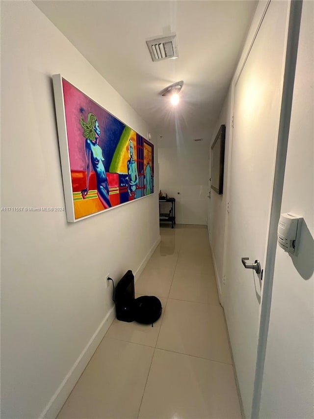 hallway featuring light tile patterned floors