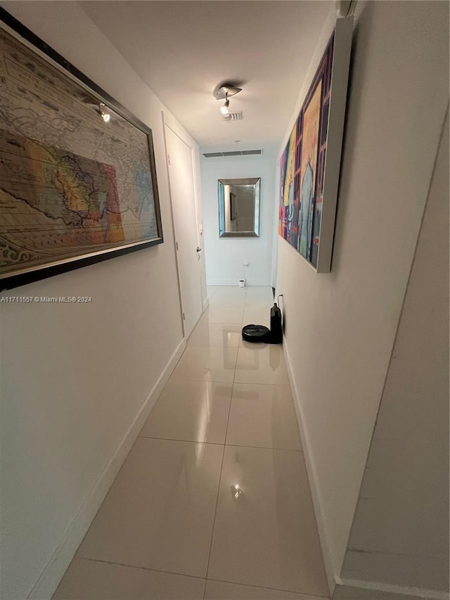 corridor with light tile patterned flooring