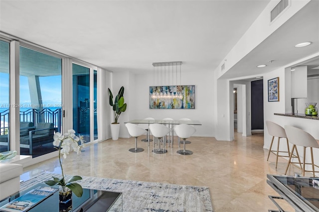 living room featuring floor to ceiling windows