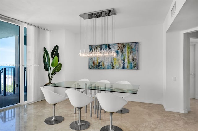 dining space with floor to ceiling windows