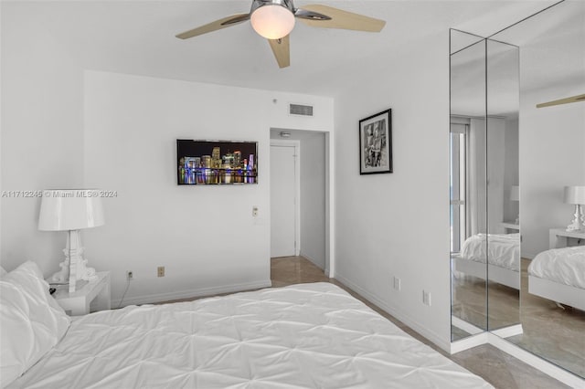 bedroom featuring ceiling fan and a closet