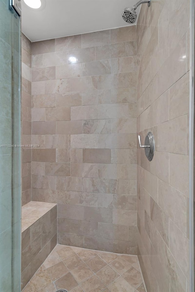 bathroom with a shower with shower door