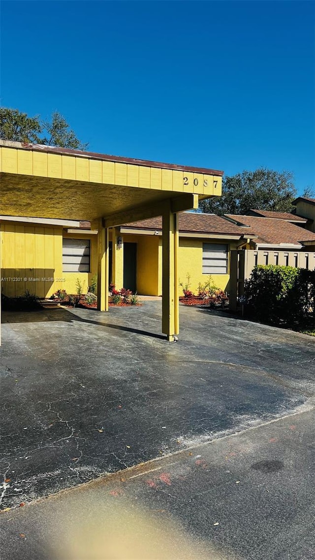 view of car parking featuring a carport