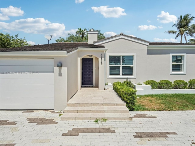 view of front of home with a garage