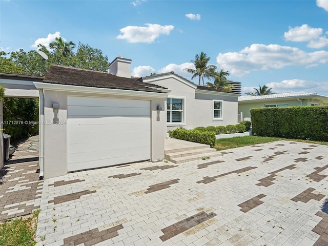 ranch-style home featuring a garage