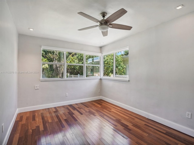 empty room featuring hardwood / wood-style floors and ceiling fan