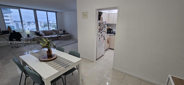 dining area featuring light tile patterned floors