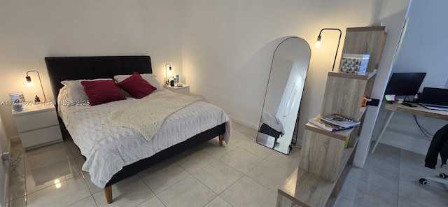 bedroom with light tile patterned flooring